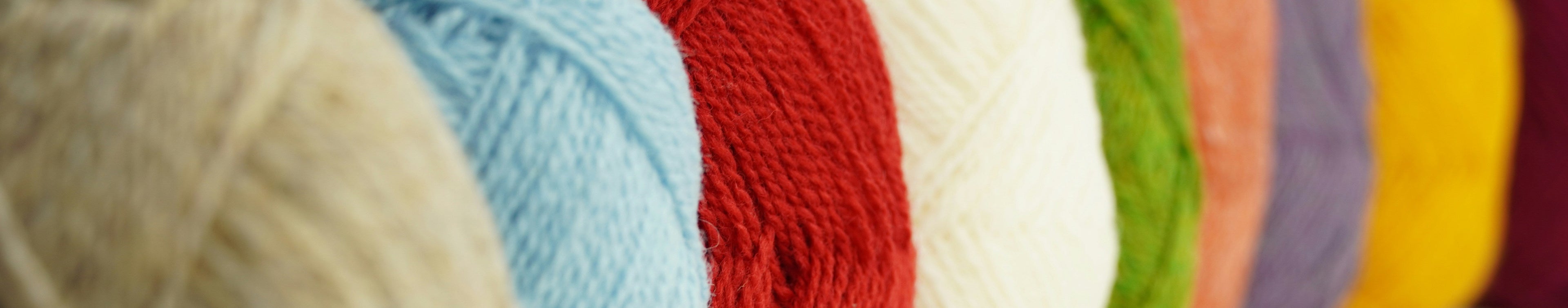 Photo de pelotes de laine La Balmo Tufting